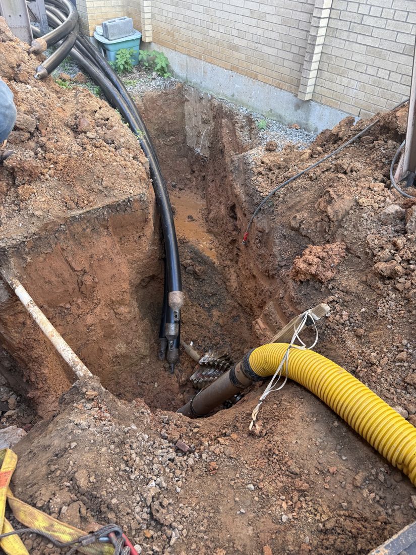 Open-cut trench with conduit